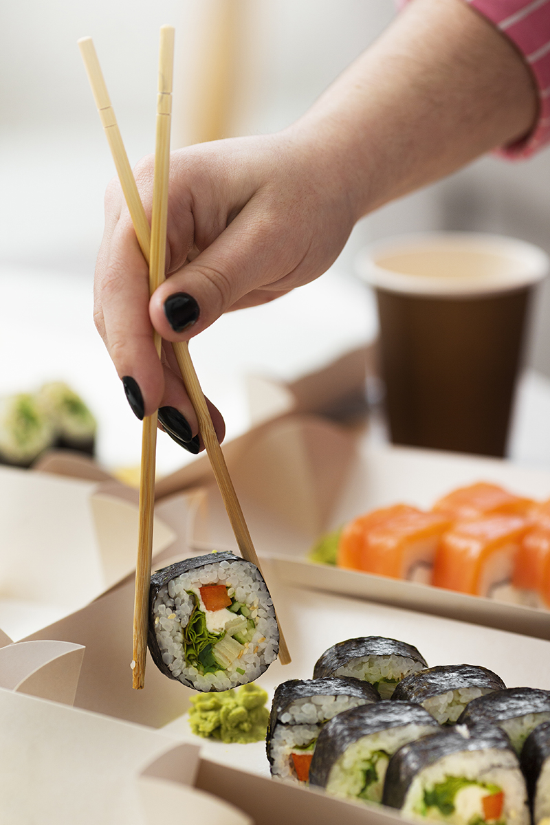 side-view-hand-holding-chopsticks